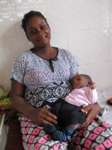 A smiling mother after a cesarean delivery at the Kwilu Ngongo Mother and Child Hospital.